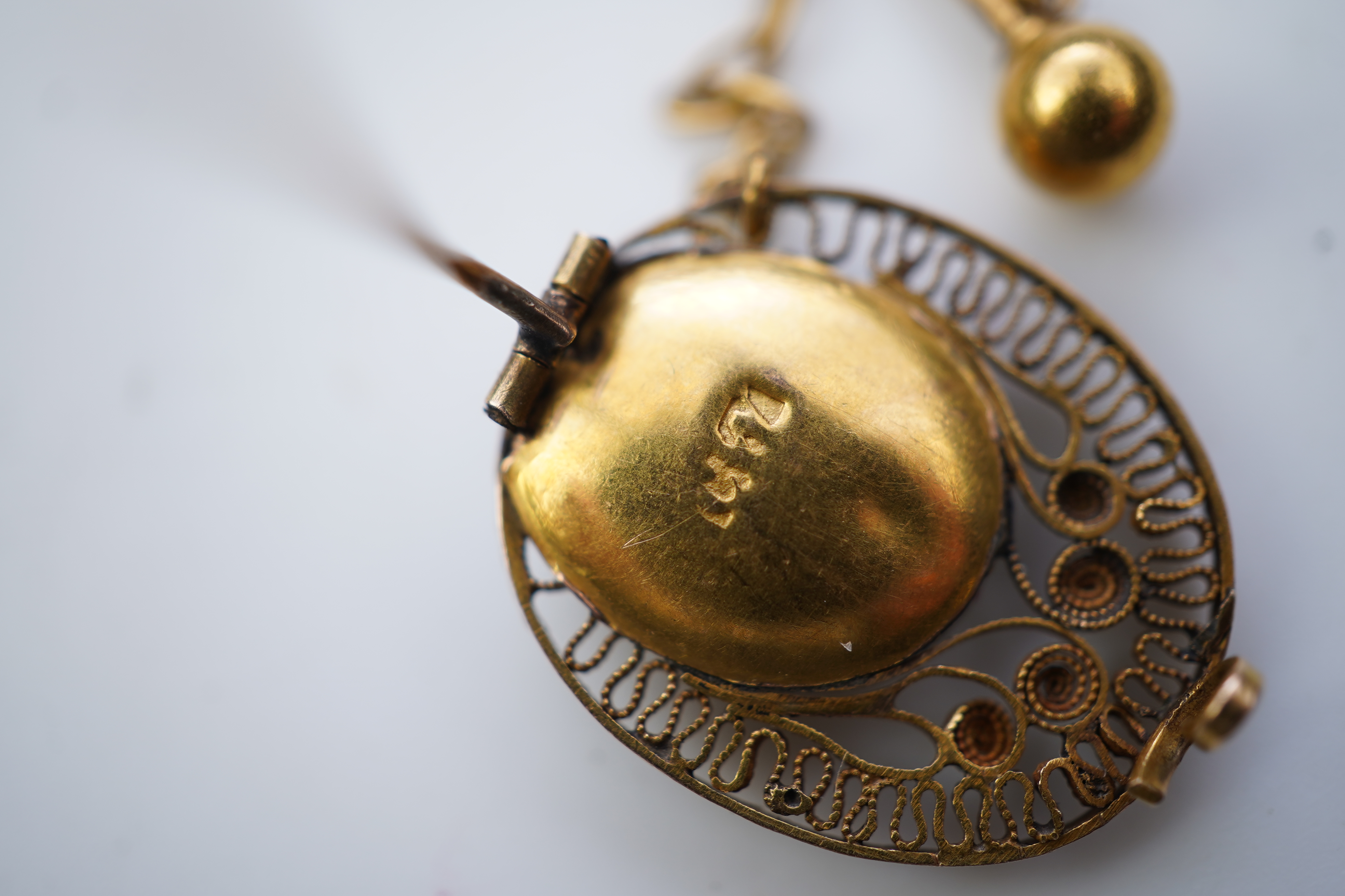 A collection of shell cameo brooches, comprising: a cameo depicting Bacchus, in a gold mount in the Archaeological Revival style, decorated with rope twist and a twisted knife wire border, length 4.4cm; together with sev